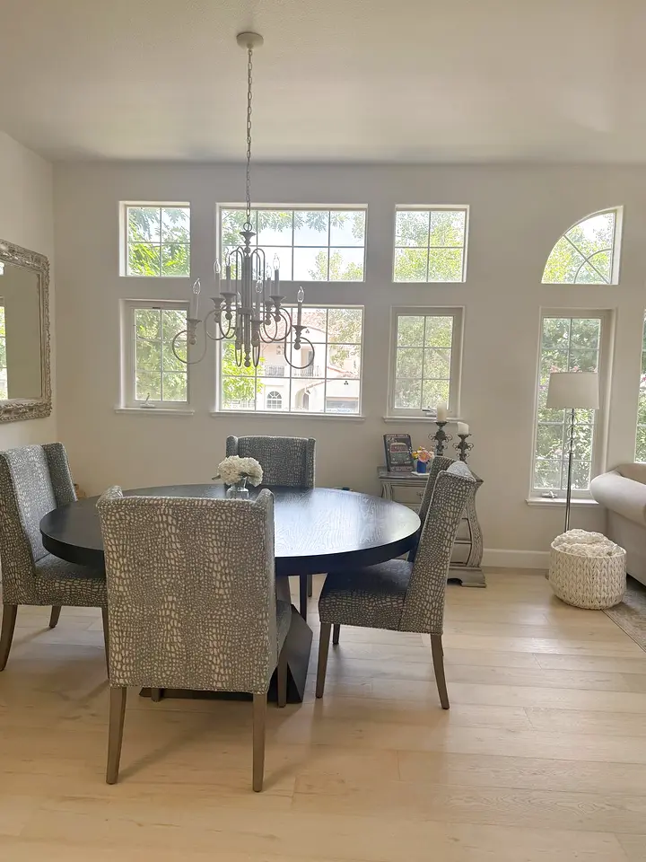 Dining room cleaned, with arched windows and natural light